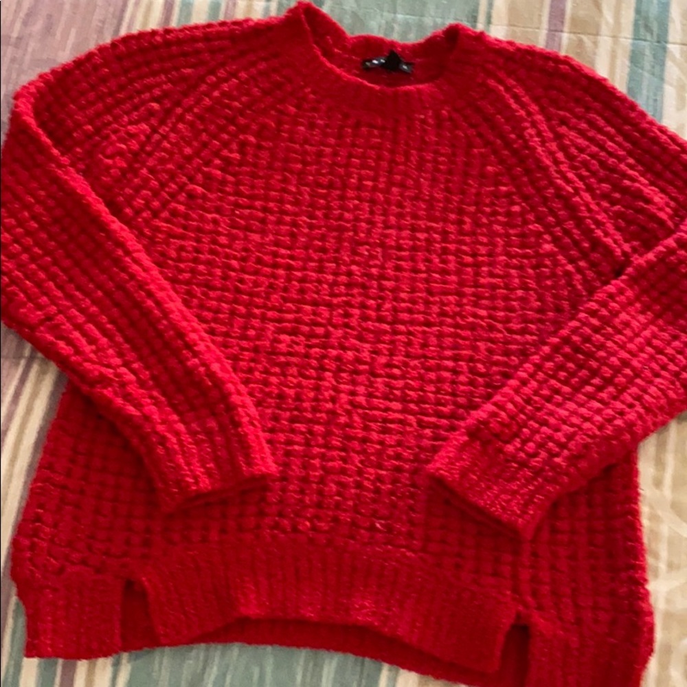 Bright red sweater